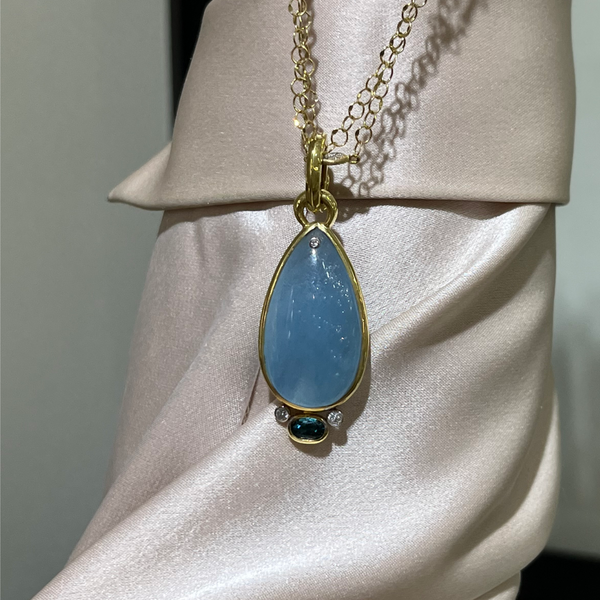 Blue Topaz and Tourmaline custom pendant.  Mystique Jewelers Alexandria, VA