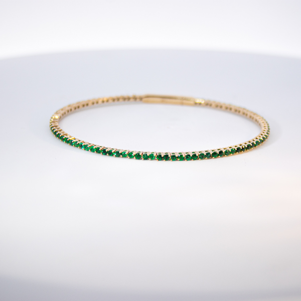 14K Gold & Green Emerald Flexible Eternity Bangle Mystique Jewelers Alexandria, VA