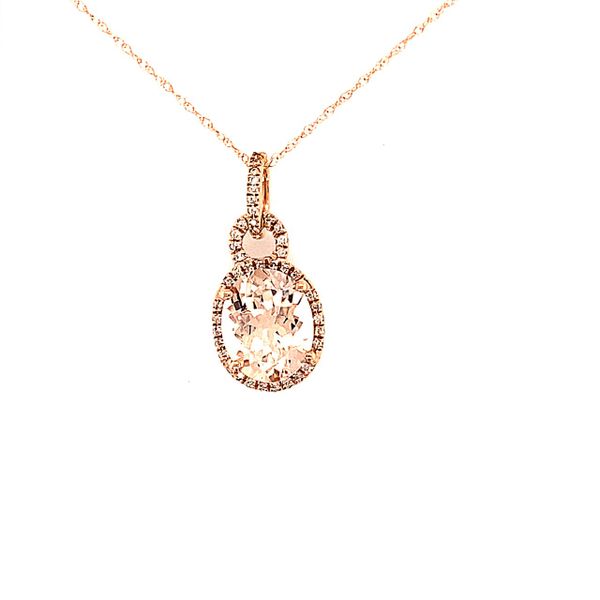 This is such a romantic piece of jewelry!!  A 2.50 oval Morganite stone is accented with .12 total diamond weight to create a