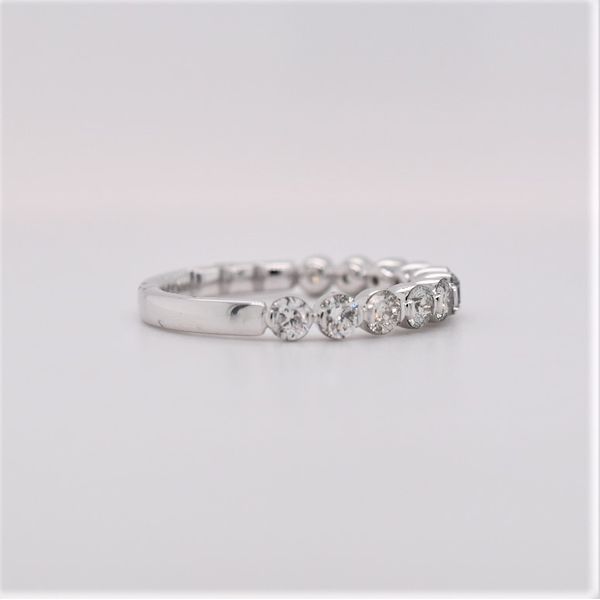 This diamond band is beautiful.  It features  shared prong set round diamonds totaling 1.0 carats. This ring can be sized to 