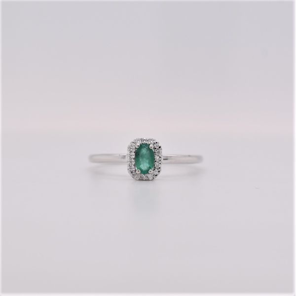 Emerald is the birthstone for May. It is also one of the most popular stones. This 14 kt white gold ring features a .16 carat