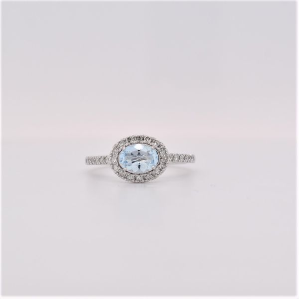 Aquamarine is the birthstone for March. This gorgeous ring features a .70 carat oval aquamarine set east-west. It is accented