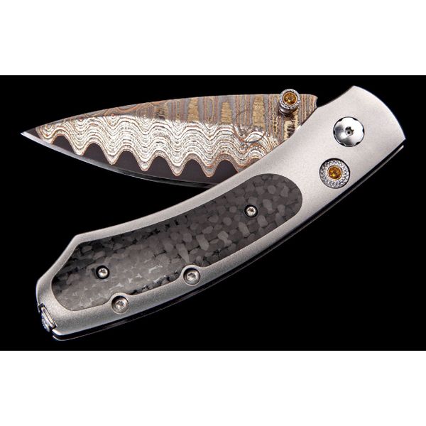 William Henry fervor series knife with Damascus steel blade and carbon fiber handle inlay
