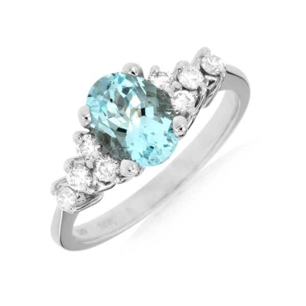 Love the look of this stunning aquamarine ring.  4 round diamonds are beautifully stacked in a semi-pyramid style on each sid