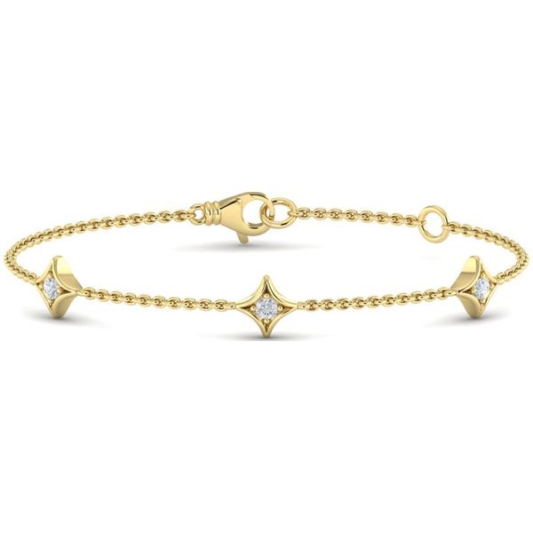 This bracelet is gorgeous!! The 14 kt yellow  gold station bracelet features three fancy rhombus shaped stations with diamond