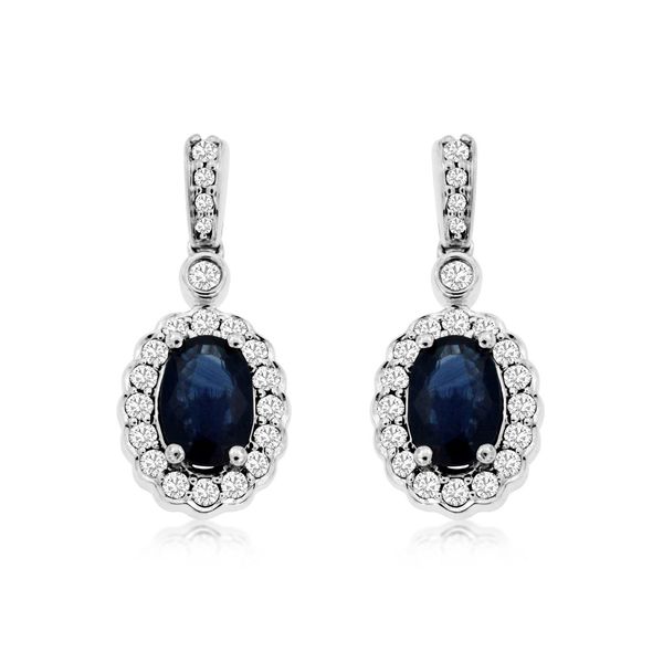 These sapphire earrings are simply spectacular!  Set in 14 kt white gold, these earrings feature oval sapphires surrounded by