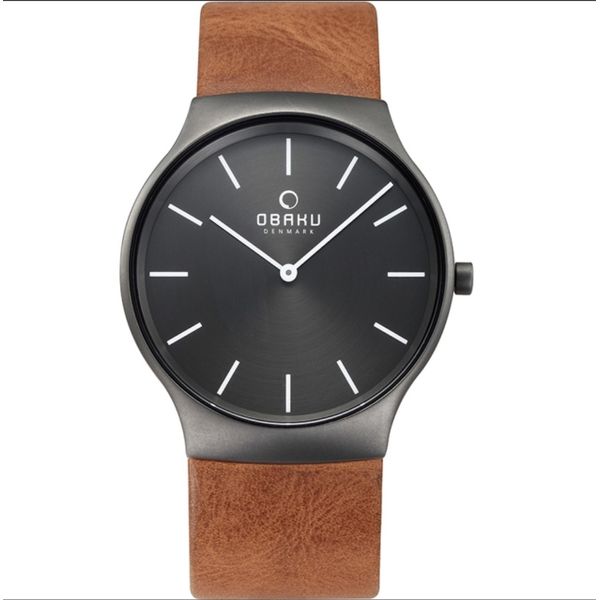 The Rolig Guntan is a masculine timepiece design created by the Danish designer Christian Mikkelsen. The design features a sm